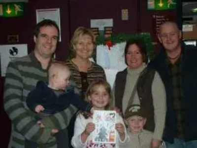 Matthew Taylor and Terrye Teverson congratulate Danielle with her brother Ozzy and Mum and Dad Maria and Harry Burns. Matthew is holding his son Jacob Taylor