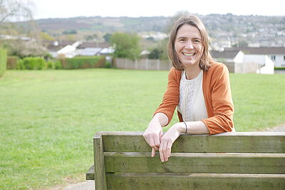 Ruth Gripper on a bench in Truro