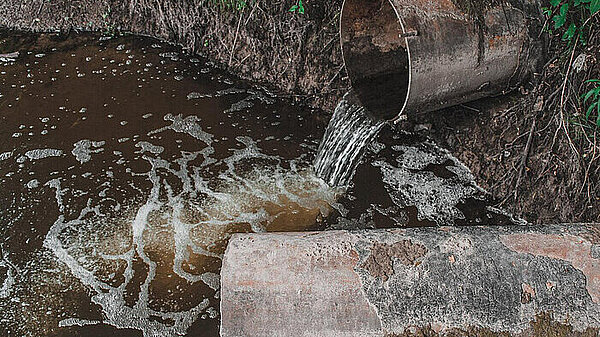 Sewage overflowing into a water course